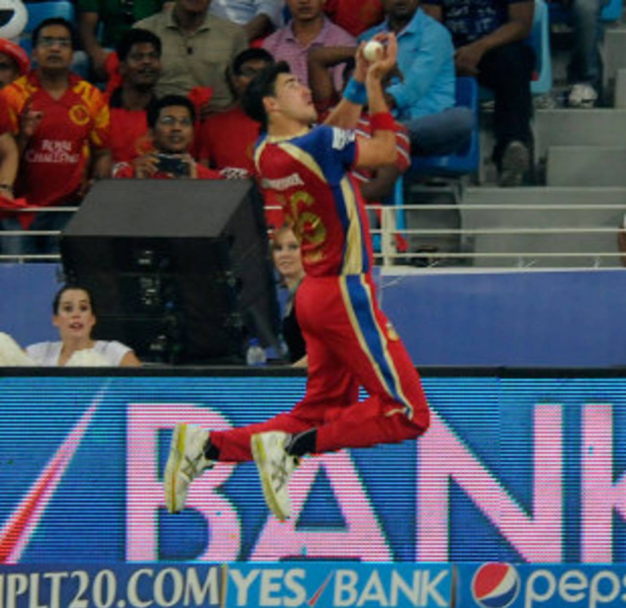 Mitchell Starc takes the first of two amazing catches, Kings XI Punjab v Royal Challengers Bangalore, IPL 2014, Dubai, April 28, 2014