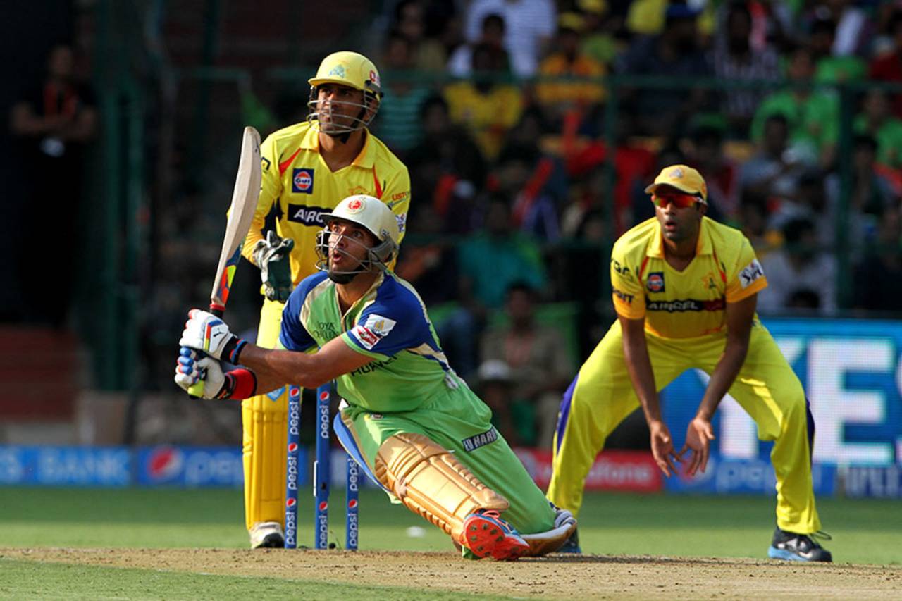 Yuvraj Singh loses his balance but still hits this slog-sweep out of the middle, Royal Challengers Bangalore v Chennai Super Kings, IPL 2014, Bangalore, May 24, 2014
