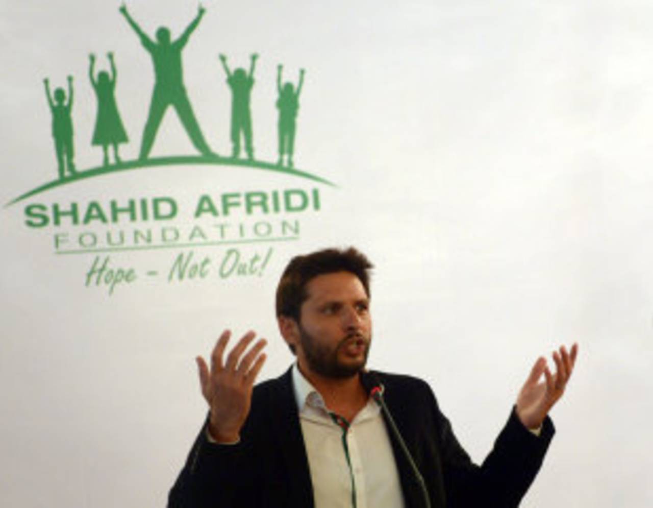 Shahid Afridi addresses the media during the launch of his charity foundation, Karachi, June 27, 2014