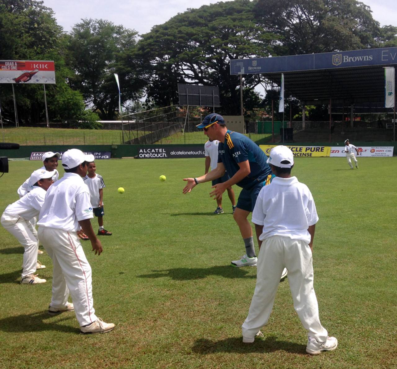 Kyle Abbott directs a fielding drill for Sri Lankan kids, Colombo, July 22, 2014