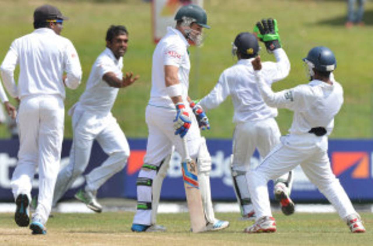 The Sri Lanka players celebrate the wicket of Dean Elgar, Sri Lanka v South Africa, 2nd Test, Colombo, 2nd day, July 25, 2014