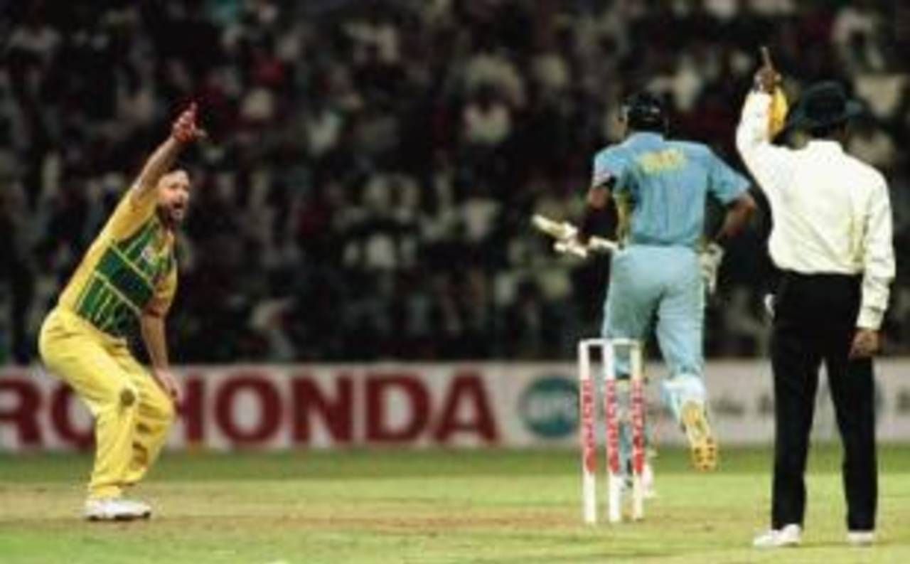 Srinath, soon to be joined by Kumble, limbers up for heroism as Tendulkar is dismissed in that 1996 Titan Cup game&nbsp;&nbsp;&bull;&nbsp;&nbsp;Carl Fourie/Action Photographics