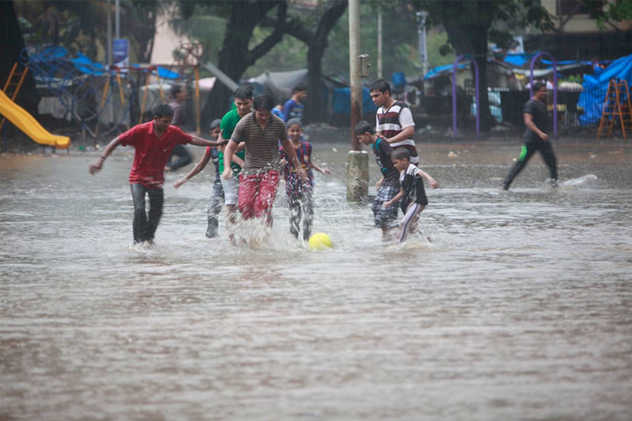 Football in the streets of water-logged Mumbai