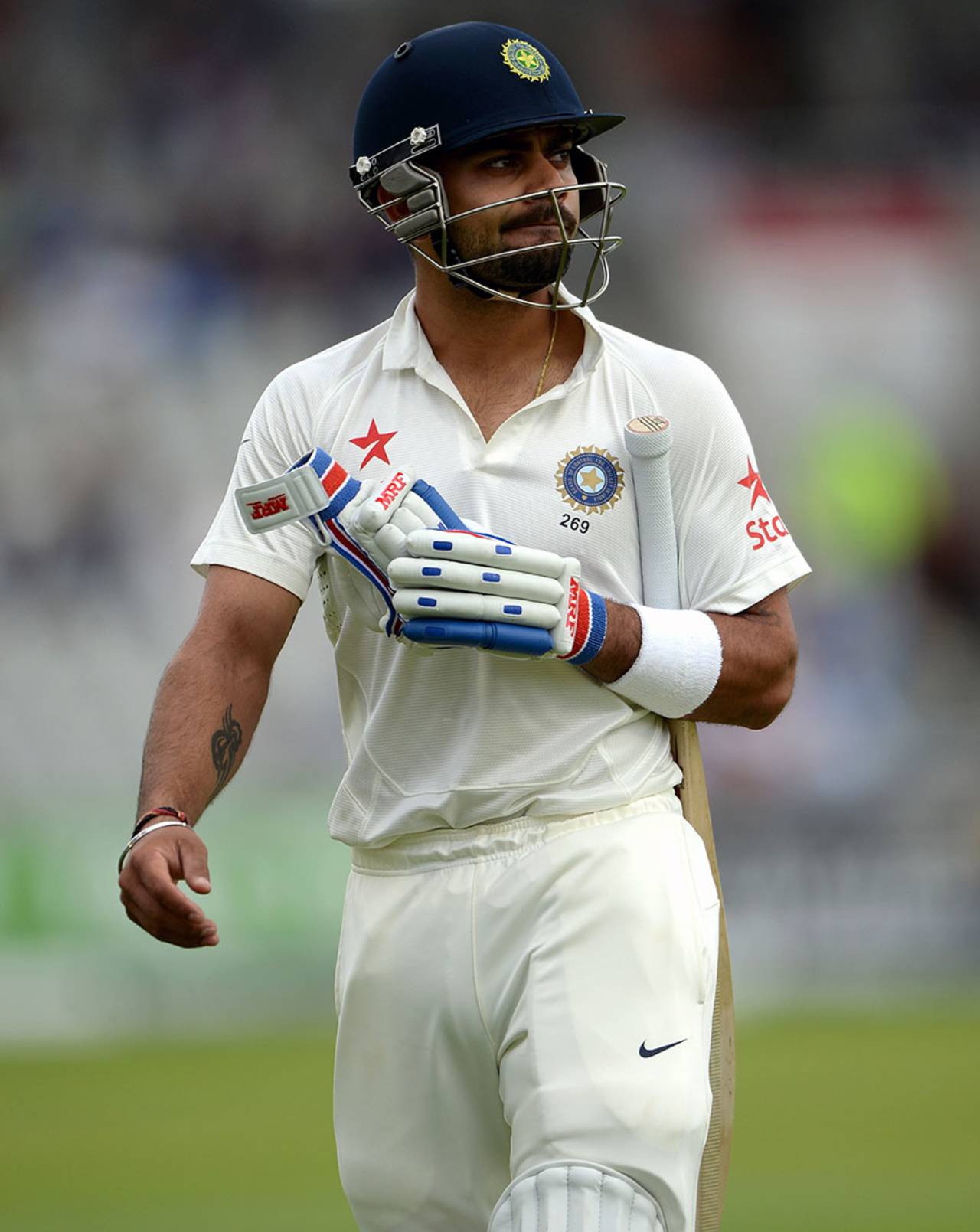 Virat Kohli trudges off after edging a James Anderson outswinger, England v India, 4th Test, Old Trafford, 1st day, August 7, 2014
