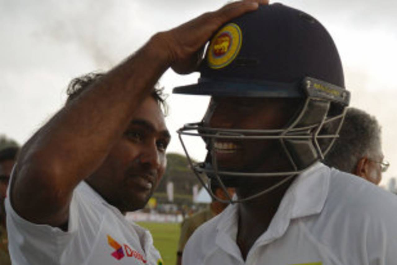 Angelo Mathews receives a pat on his helmet after hitting the winning runs, Sri Lanka v Pakistan, 1st Test, Galle, 5th day, August 10, 2014