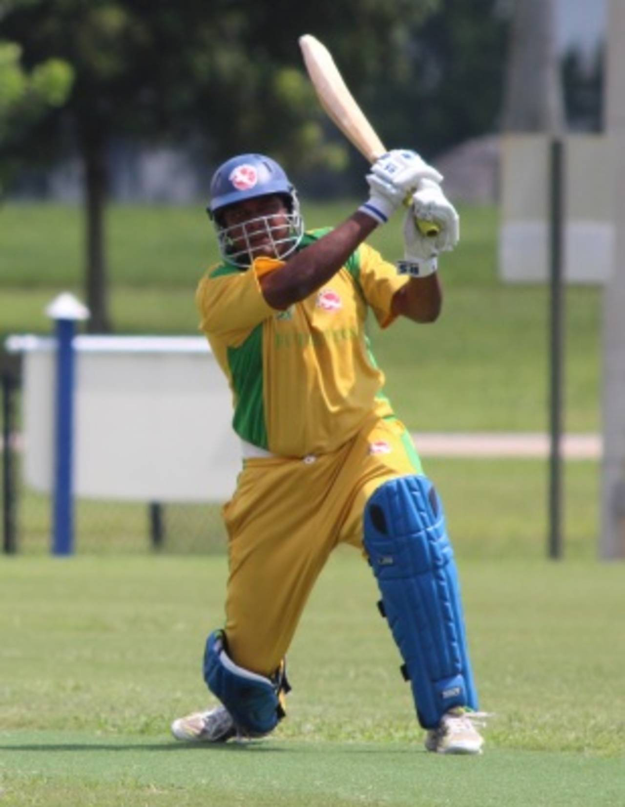 Aditya Thyagarajan completes a lofted drive over extra cover, North East v South West USACA T20 National Championship, Lauderhill, August 15, 2014