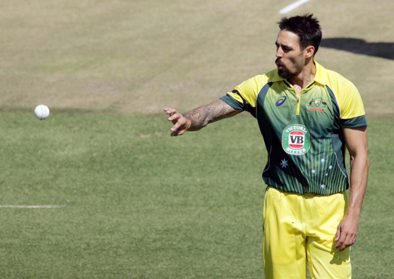 Mitchell Johnson collects the ball, Zimbabwe v Australia, Tri-series, Harare, August 25, 2014