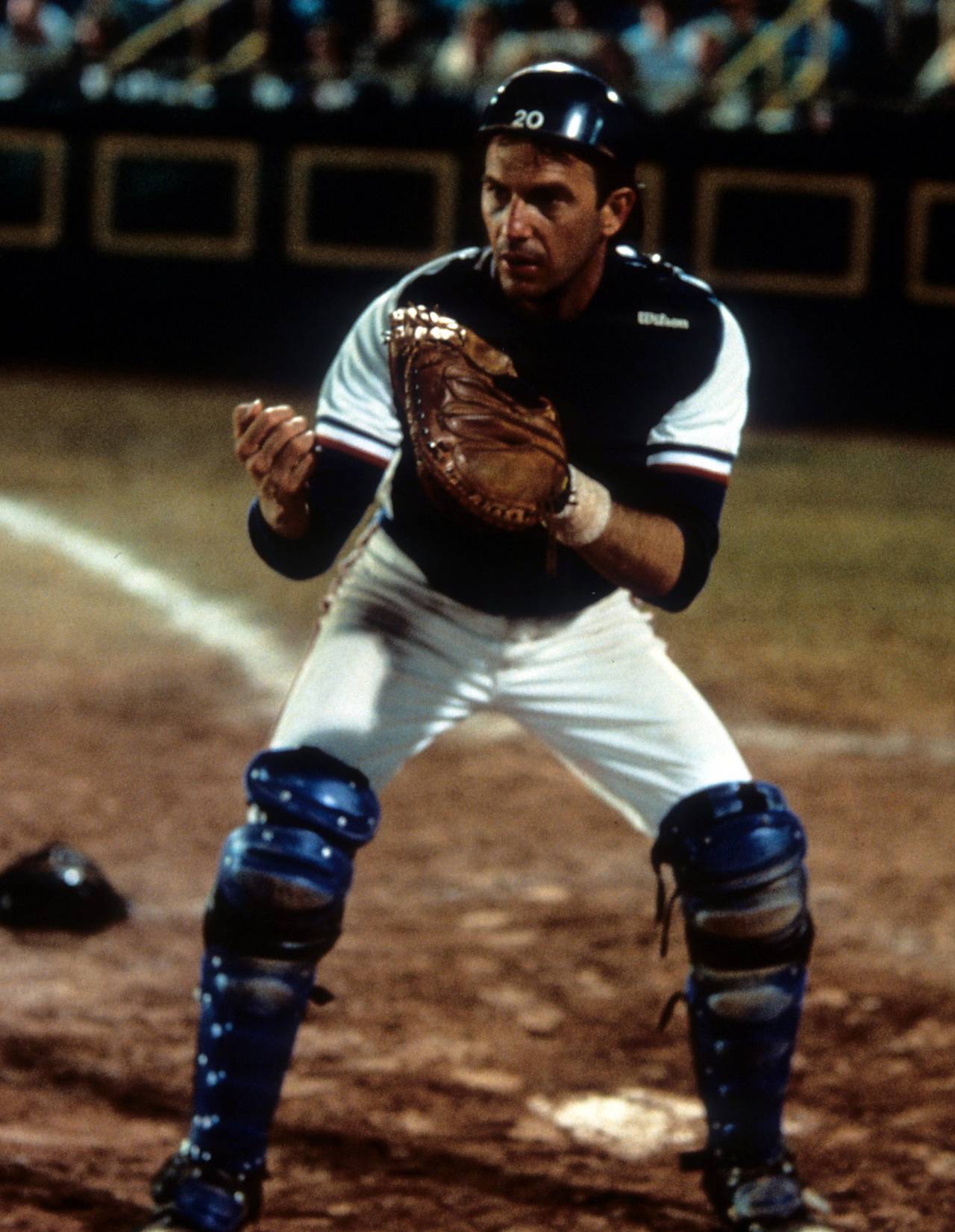 Kevin Costner plays catcher on a baseball team in a scene from the film <i>Bull Durham</i>, 1988