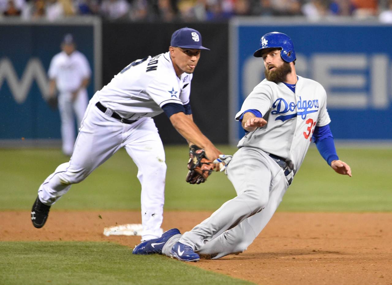 Jace Peterson tags Scott Van Slyke but Van Slyke was ruled safe after an instant replay review, San Diego Padres v Los Angeles Dodgers, San Diego, June 20, 2014