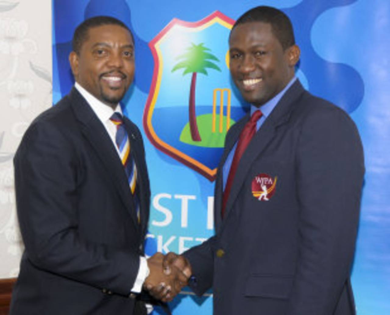 Dave Cameron, the WICB president, and Wavell Hinds, the WIPA president, at the agreement-signing ceremony, Bridgetown, September 18, 2014