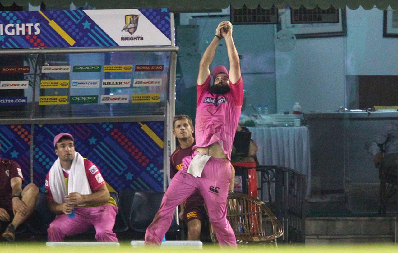 Anton Devcich leaps to clasp a difficult chance at the boundary, Kings XI Punjab v Northern Knights, Champions League T20, Mohali, September 26, 2014