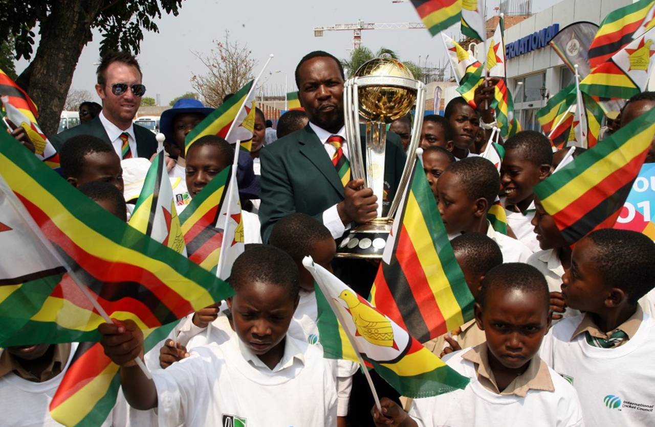 Hamilton Masakadza and Brendan Taylor with the World Cup trophy, September 30, 2014