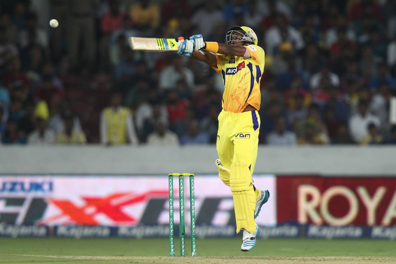 Dwayne Bravo goes airborne during his fifty, Kings XI Punjab v Chennai Super Kings, 2nd semi-final, CLT20, Hyderabad, October 2, 2014