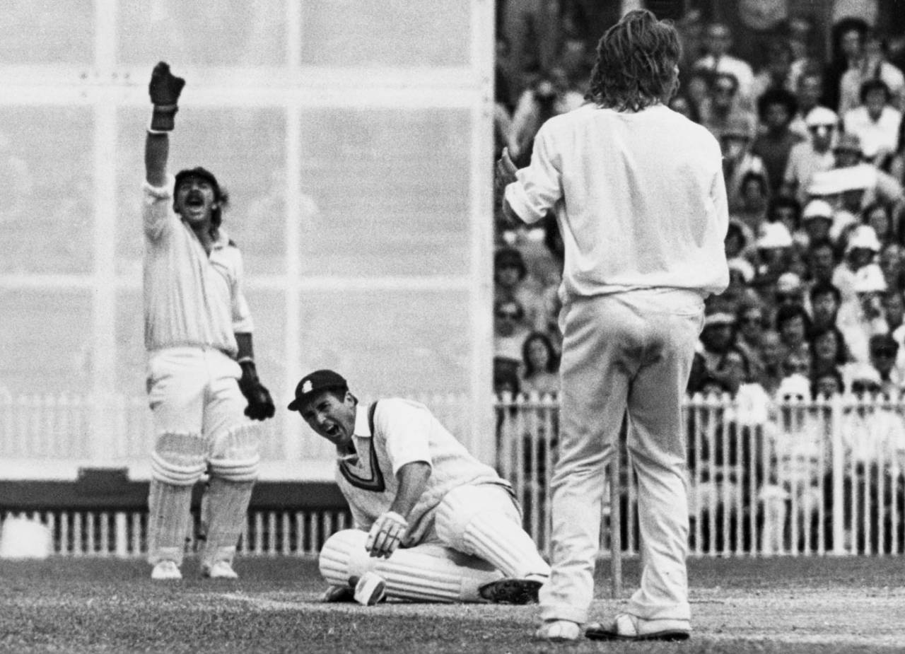 Fred Titmus falls to the ground after receiving a blow to his knee by Jeff Thomson in Melbourne&nbsp;&nbsp;&bull;&nbsp;&nbsp;Getty Images