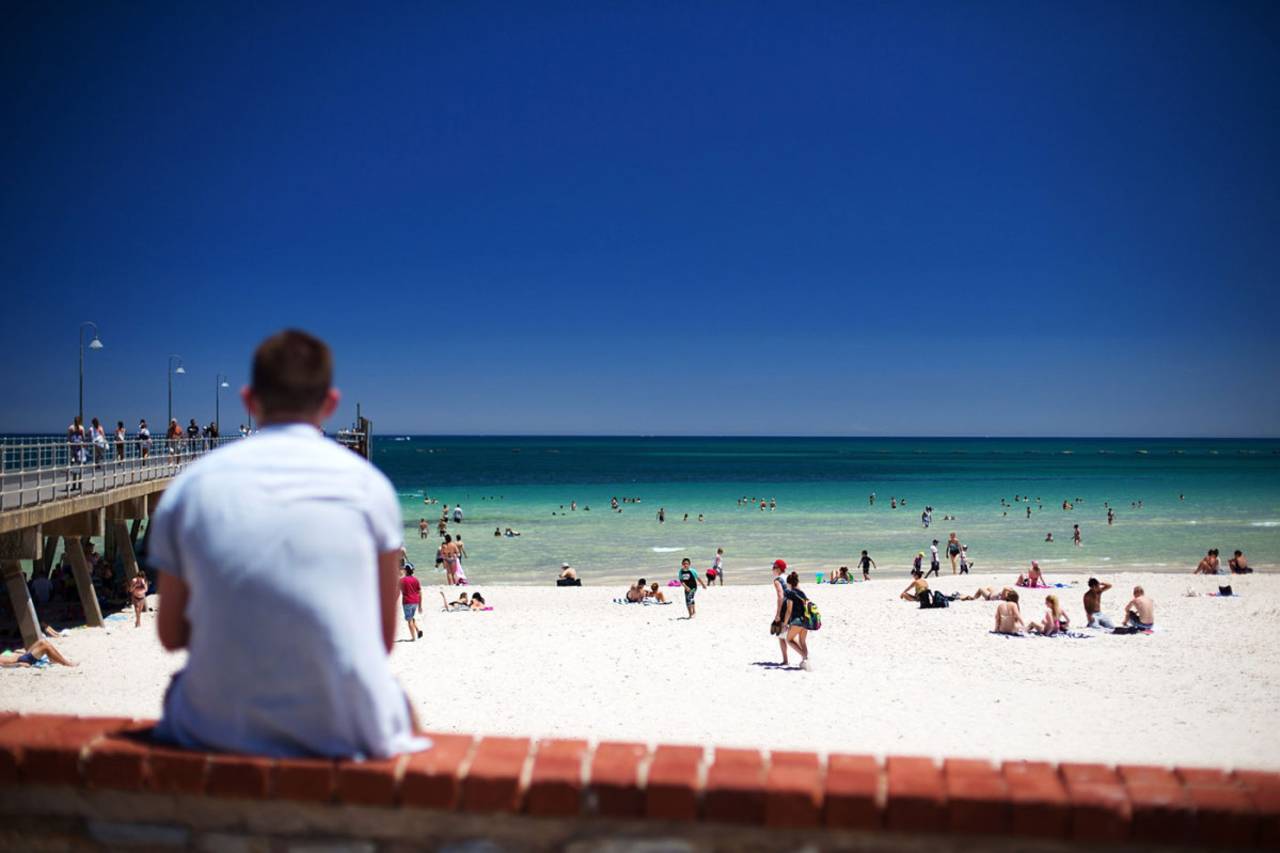 Beach-goers cool off during a heat wave at Glenelg beach, Adelaide, January 13, 2014