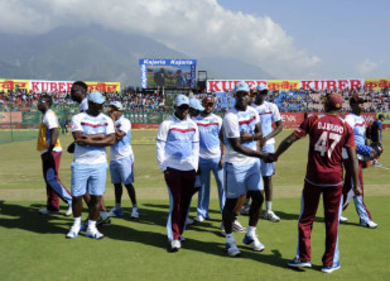 Dwayne Bravo arrives at the toss with his team-mates, India v West Indies, 4th ODI, Dharamsala, October 17, 2014