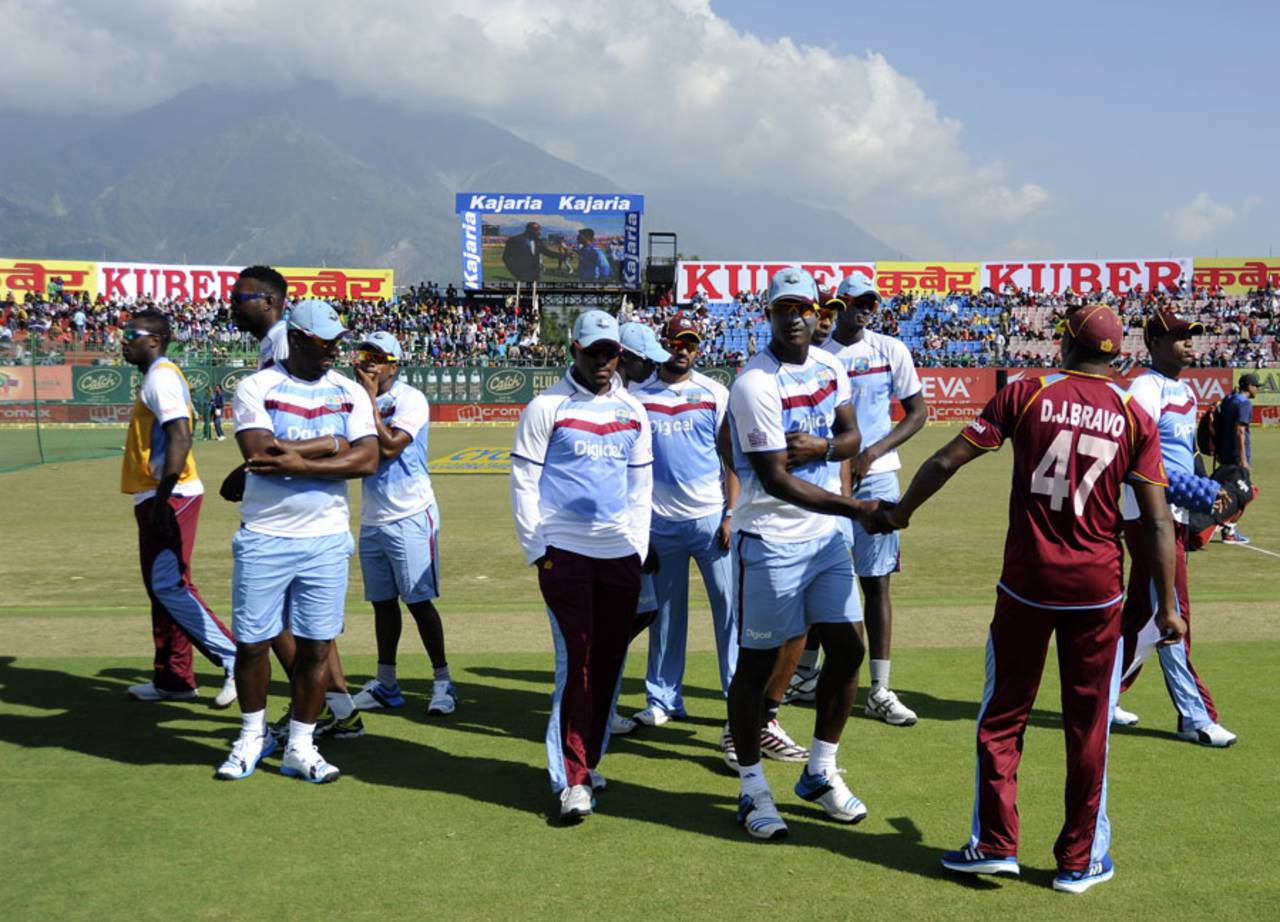 Dwayne Bravo arrives at the toss with his team-mates, India v West Indies, 4th ODI, Dharamsala, October 17, 2014