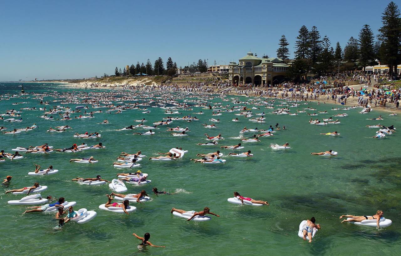 Holiday-makers relax in the waters by Cottesloe beach on Australia Day, January 26, 2011