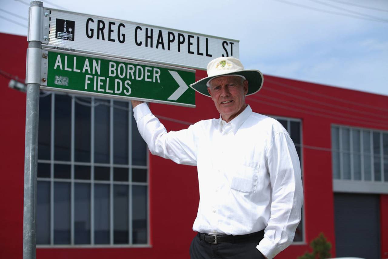 Greg Chappell next to a sign of a street named after him at the National Cricket Centre, Brisbane, November 11, 2013