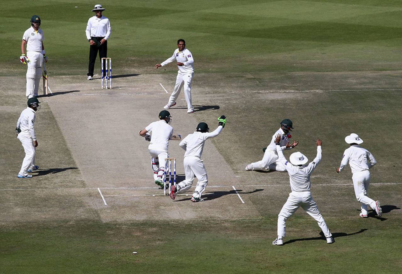 Azhar Ali has a bit of a juggle before catching Nathan Lyon at silly point, Pakistan v Australia, 2nd Test, Abu Dhabi, 5th day, November 3, 2014