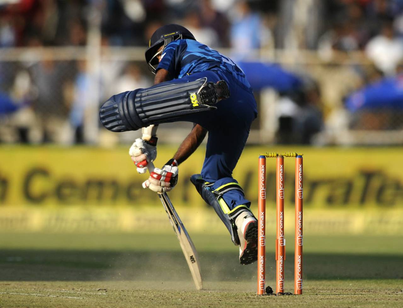 Dhammika Prasad plays an unorthodox block, India v Sri Lanka, 2nd ODI, Ahmedabad, November 6, 2014