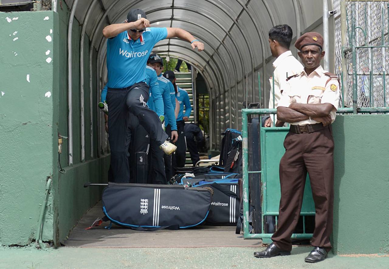 There was a bit of an obstacle course for Alastair Cook as he made his way out to field, Sri Lanka A v England XI, Tour match, SSC, Colombo, November 21, 2014