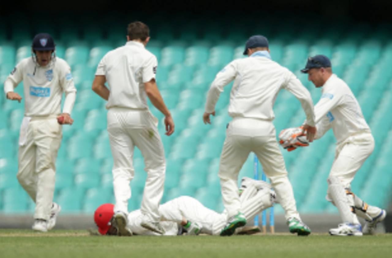 Phillip Hughes falls to the ground after being struck by a Sean Abbott bouncer, New South Wales v South Australia, Sheffield Shield, Sydney, 1st day, November 25, 2014