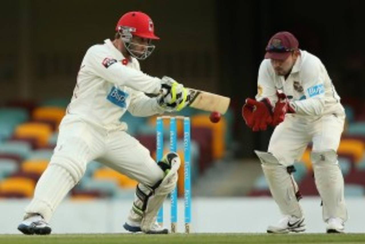 Phillip Hughes cuts in front of Chris Hartley, Queensland v South Australia, Sheffield Shield, Brisbane, 2nd day, October 2, 2012