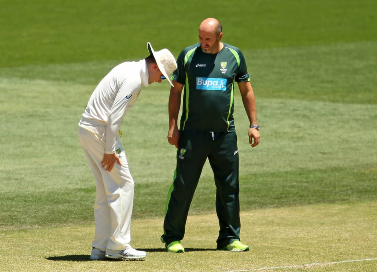 Michael Clarke speaks to physio Alex Kountouris about his hamstring, Australia v India, 1st Test, Adelaide, 5th day, December 13, 2014