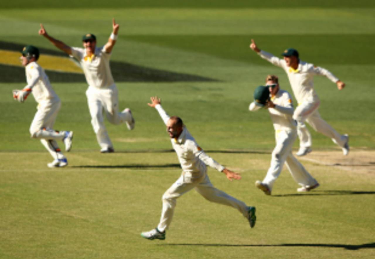 Nathan Lyon sets off in celebration after sealing Australia's win, Australia v India, 1st Test, Adelaide, 5th day, December 13, 2014