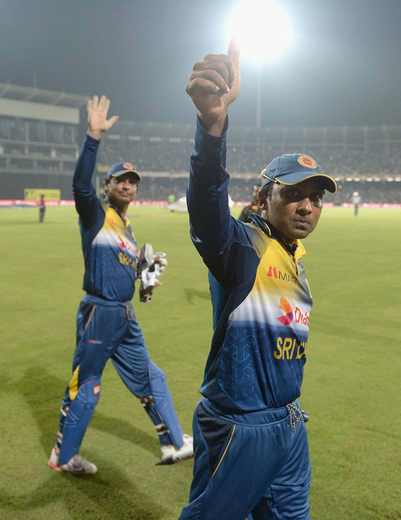 Mahela Jayawardene and Kumar Sangakkara salute the Colombo crowd one last time on a lap of honour following the win&nbsp;&nbsp;&bull;&nbsp;&nbsp;Getty Images
