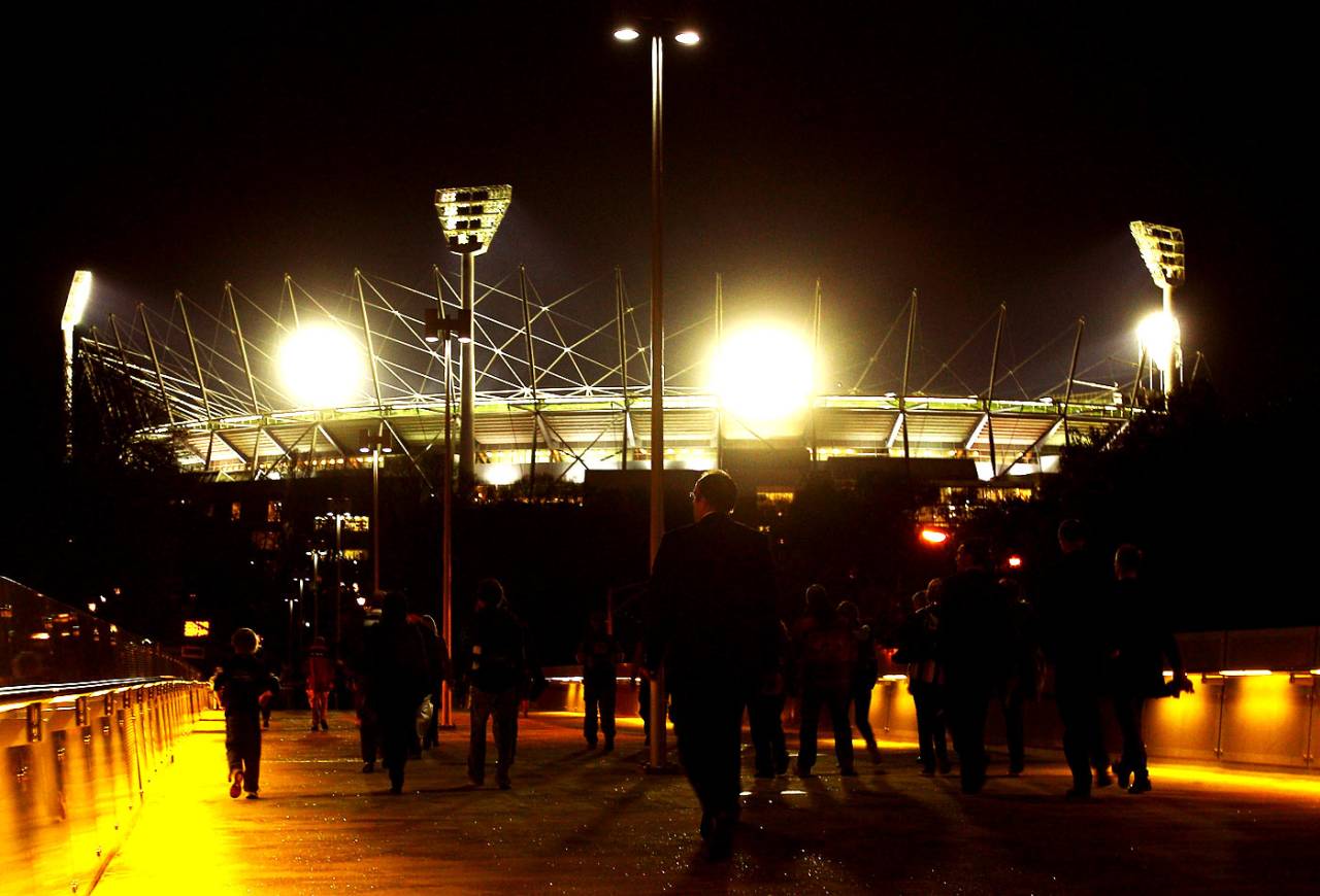 Spectators arrive for the AFL second qualifying final match between the Geelong Cats and the St Kilda Saints at the MCG, Melbourne, September 3, 2010
