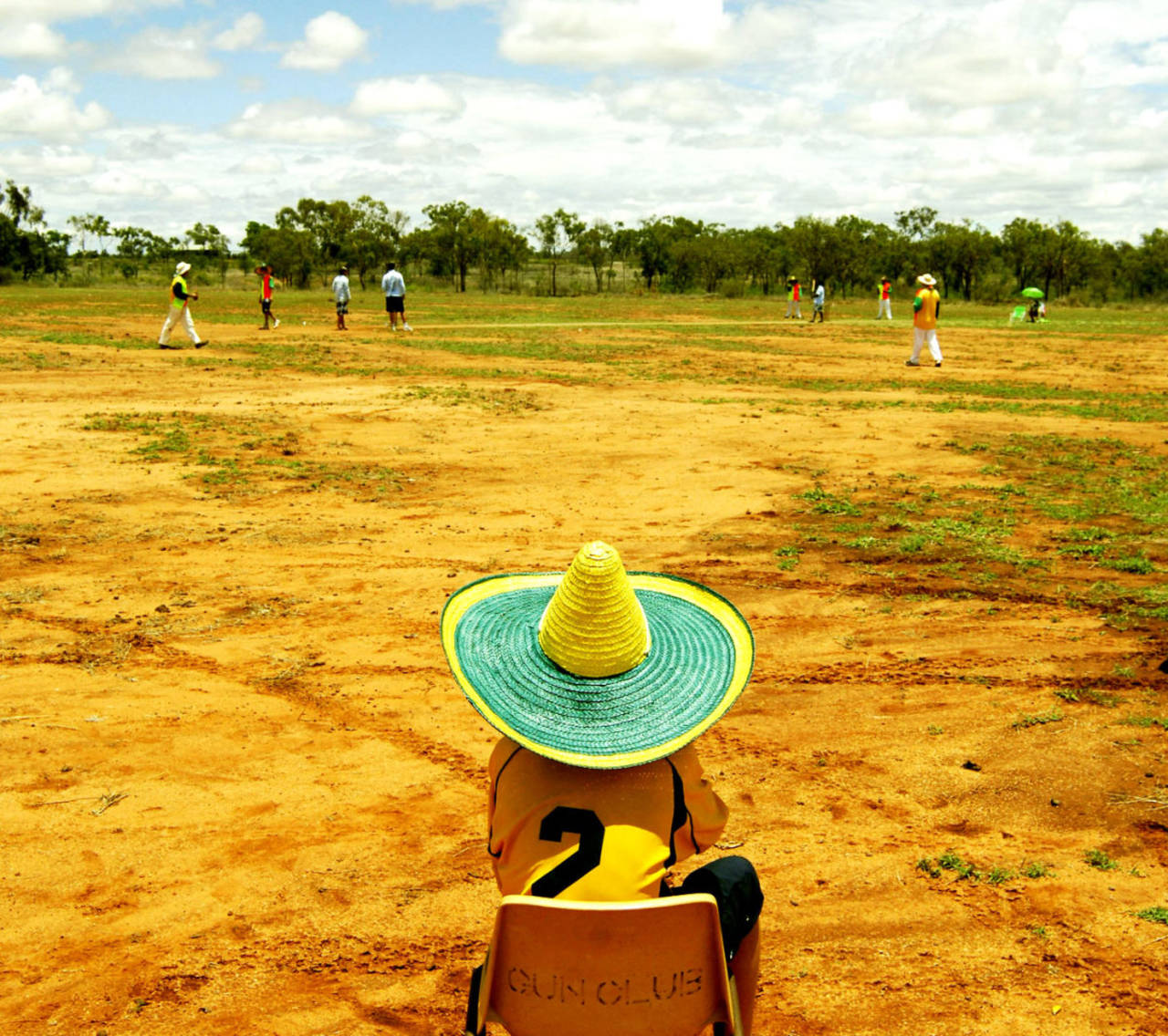A spectator watches a social grade of cricket during the Goldfield Ashes in Charters Towers, January 27, 2007 