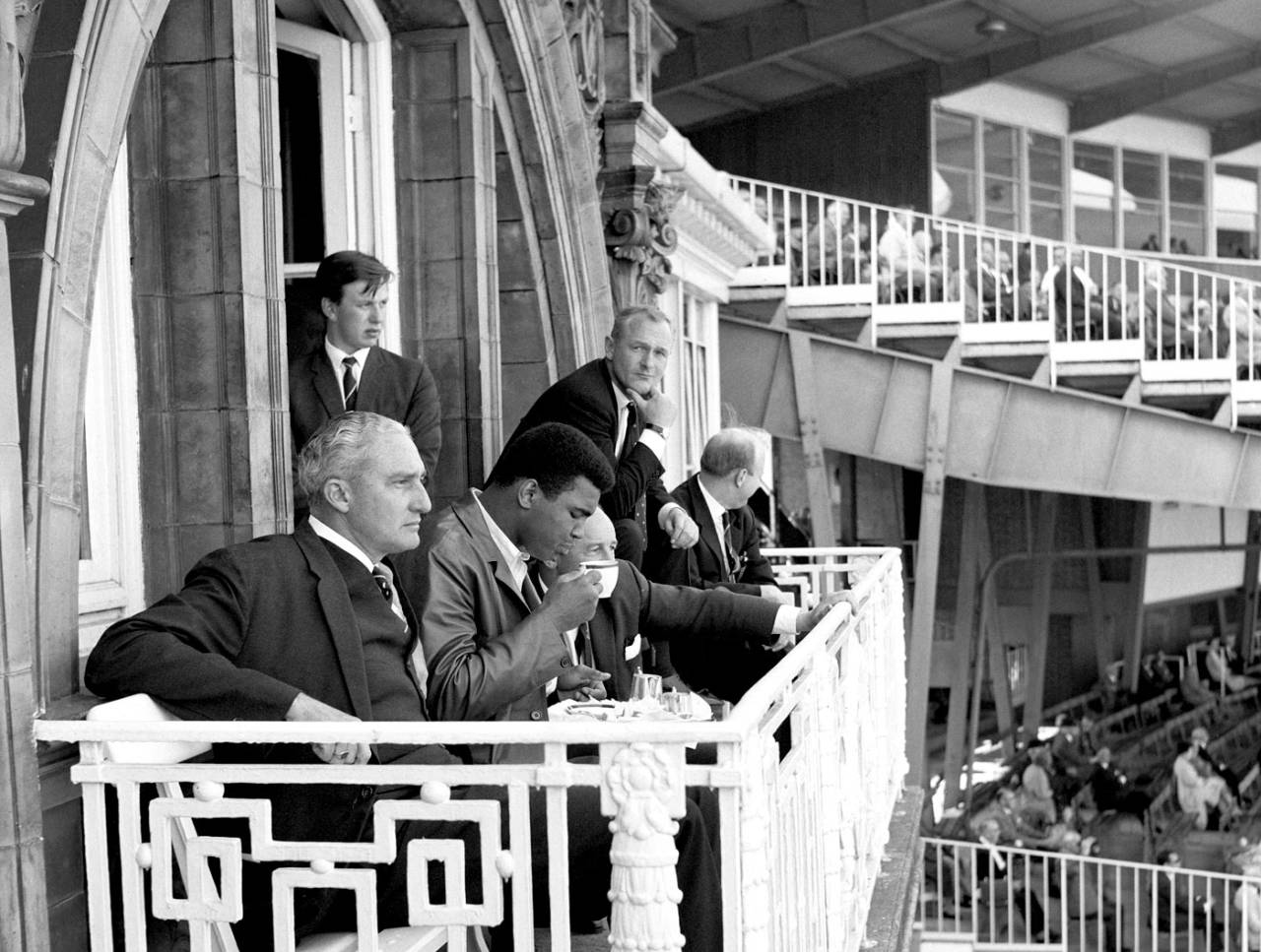 Muhammad Ali sips a cup of tea on the Lord's balcony next to West Indies manager Jeffrey Stollymeyer, England v West Indies, Lord's, 1st day, June 16, 1966