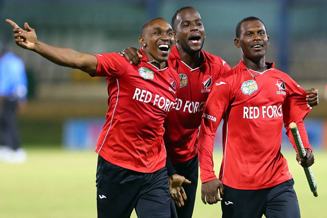 Dwayne Bravo, Kevon Cooper and Jason Mohammed celebrate T&T's win, Trinidad & Tobago v Guyana, Nagico Super50 final, Trinidad, January 25, 2014