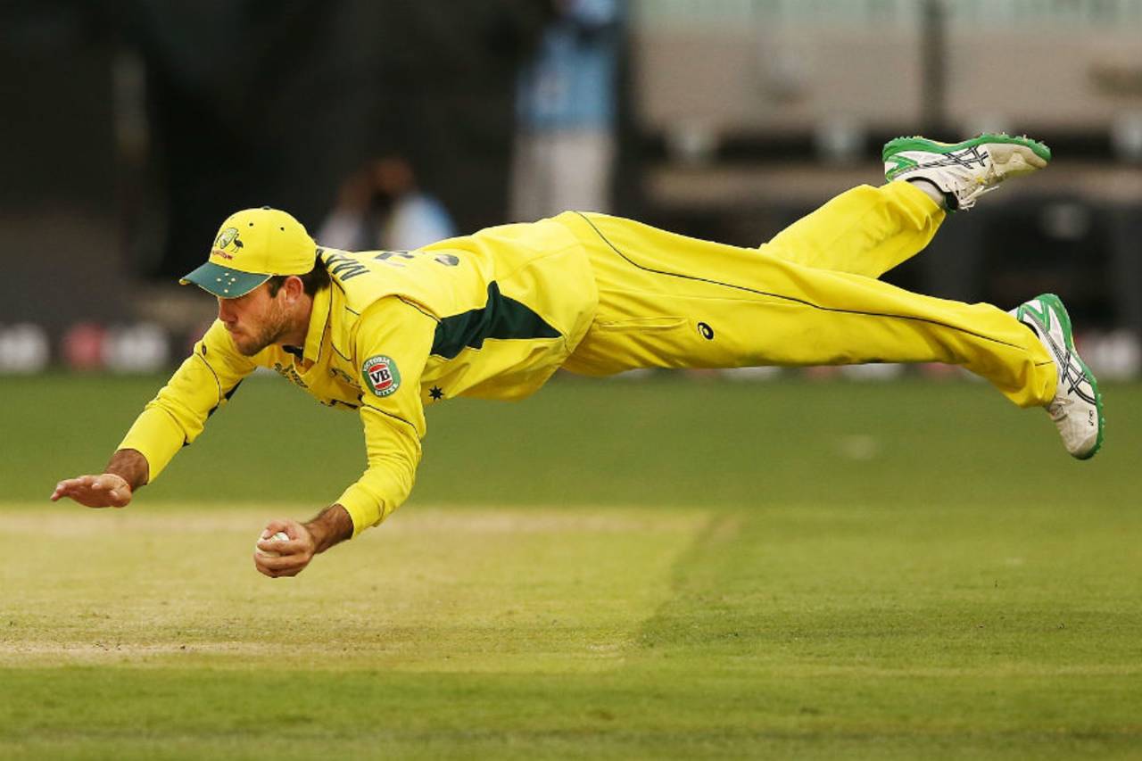 Glenn Maxwell takes an acrobatic catch to dismiss Shaiman Anwar, Australia v UAE, World Cup warm-up, Melbourne, February 11, 2015