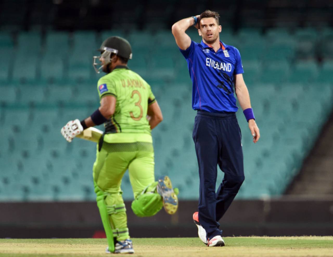 A disappointed James Anderson looks on as Umar Akmal takes a run, England v Pakistan, World Cup warm-up, Sydney, February 11, 2015