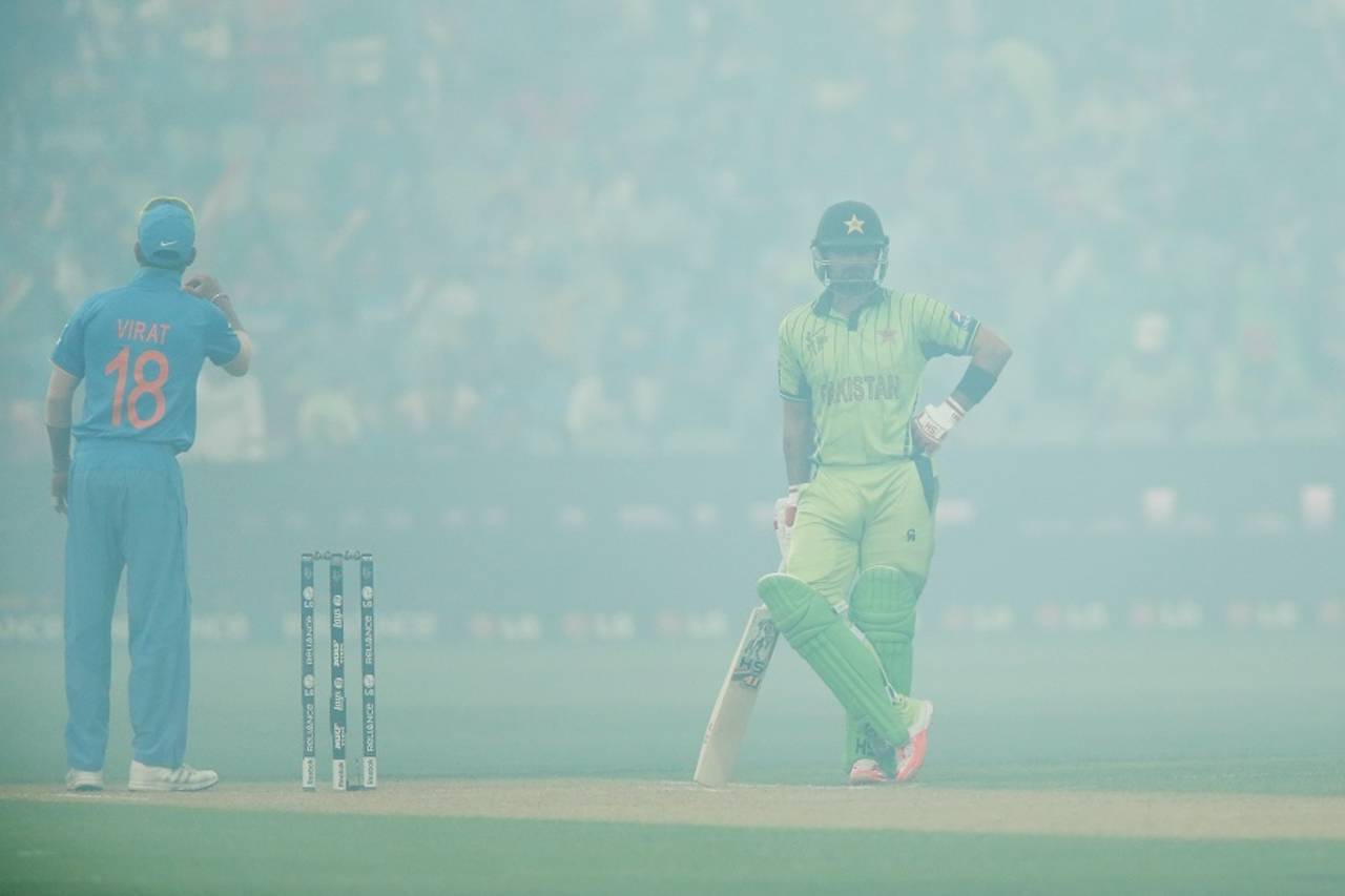 Ahmed Shehzad and Virat Kohli wait for the smoke to clear, India v Pakistan, World Cup 2015, Group B, Adelaide, February 15, 2015