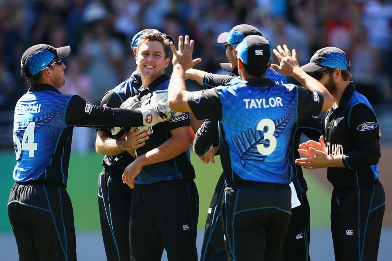 Trent Boult is mobbed after bowling Mitchell Marsh for a duck&nbsp;&nbsp;&bull;&nbsp;&nbsp;Getty Images