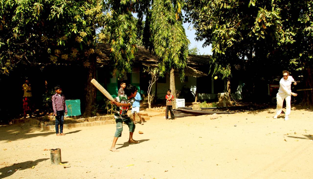 Author Nicholas Hogg bowls to a boy in Kathiawada, February 2015