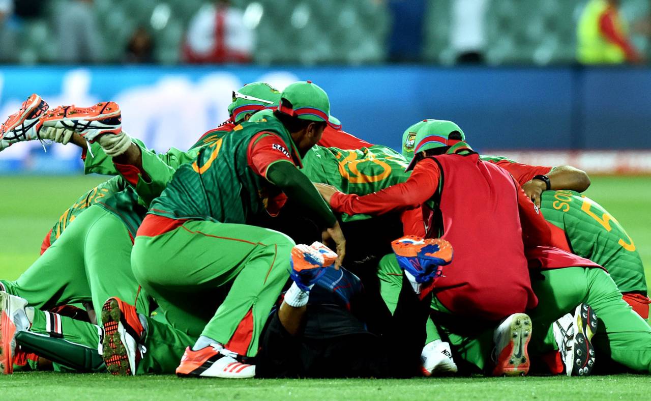 The Bangladesh players pile on top of each other after their victory, England v Bangladesh, World Cup 2015, Group A, Adelaide, March 9, 2015
