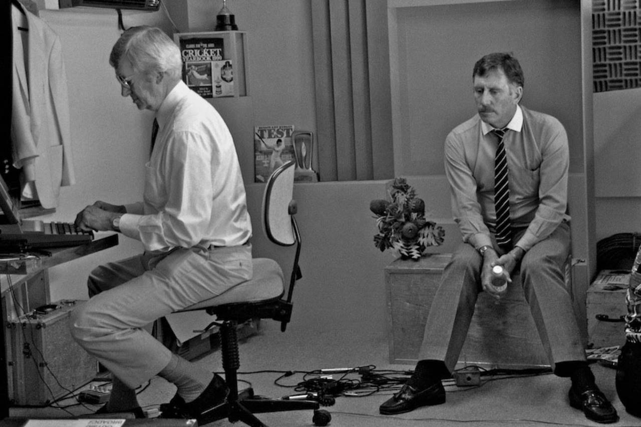 Richie Benaud types away in his computer as fellow commentator Ian Chappell watches, Perth, January, 1991