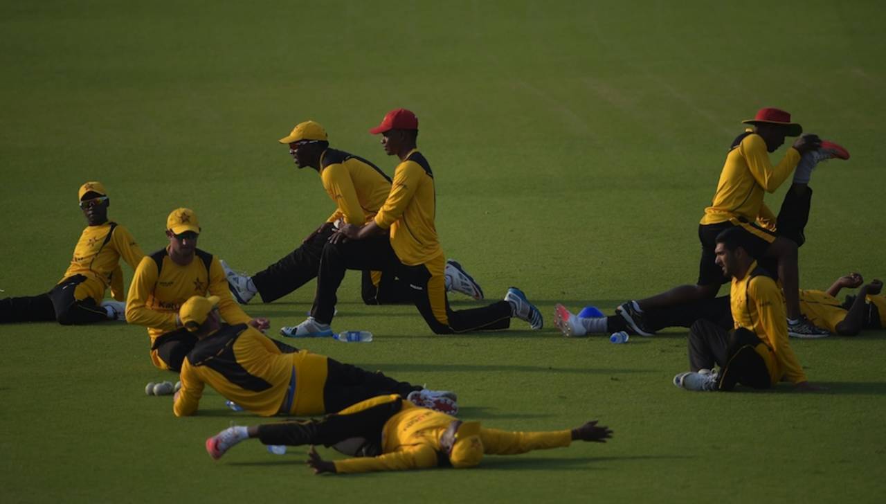 The Zimbabwe players stretch before a net session at the Gaddafi Stadium, Lahore, May 20, 2015