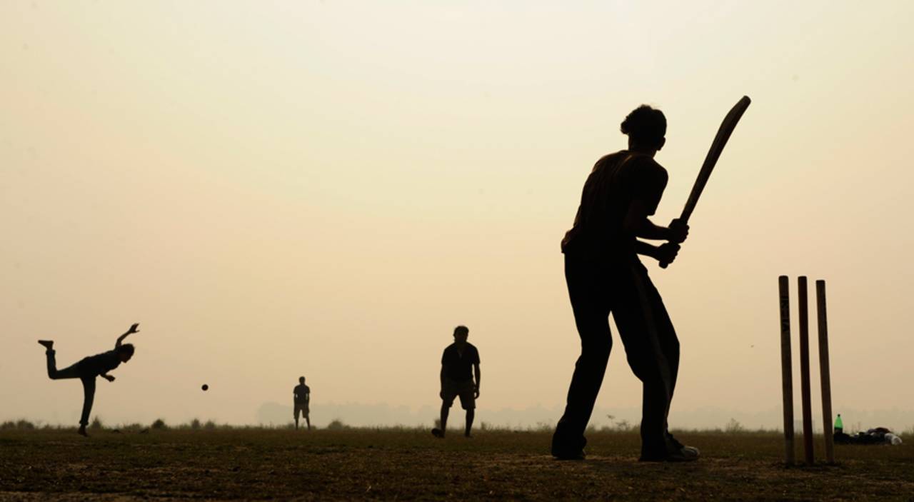 Kids play cricket on a foggy Kolkata morning, March 2011