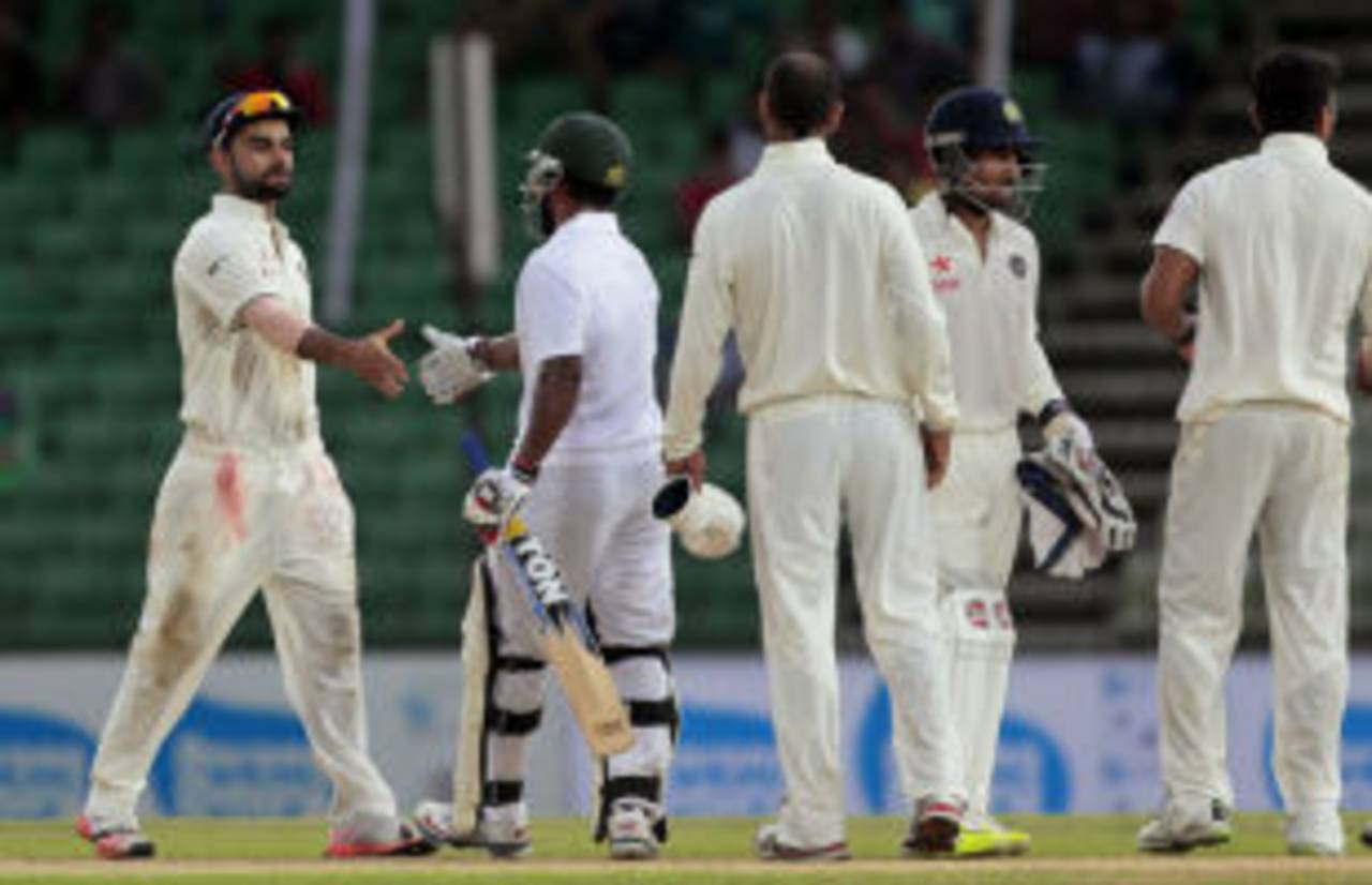 Virat Kohli shakes hands with Imrul Kayes after both teams settled for a draw&nbsp;&nbsp;&bull;&nbsp;&nbsp;Associated Press