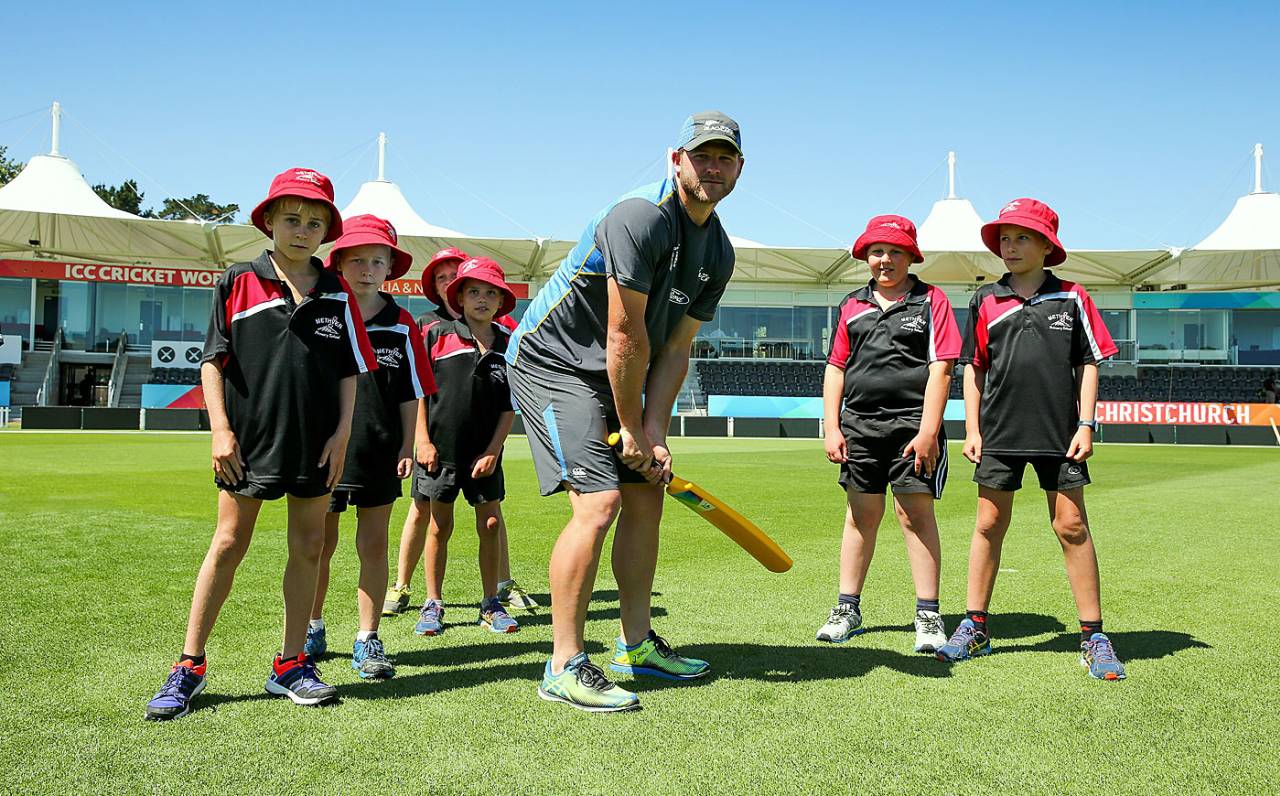 Corey Anderson teaches kids batting at an ICC coaching clinic at Hagley Oval, Christchurch, February 12, 2015