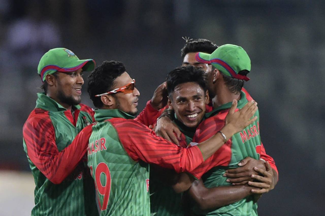 The Bangladesh players celebrated Mustafizur Rahman's five wickets by jumping on him, tugging at his cheeks and even kissing him&nbsp;&nbsp;&bull;&nbsp;&nbsp;AFP