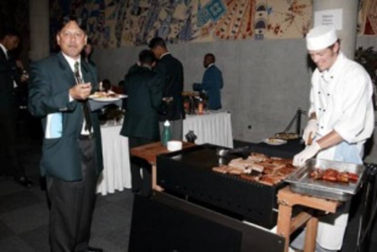Players enjoy the selection of food available, including a Kiwi barbecue after the ICC Under-19 World Cup opening ceremony at the Christchurch Convention Centre. 14 January 2002.