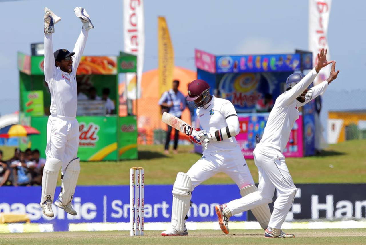 West Indies had an uphill task going into the fourth day, still trailing by 166 and the visitors' day got even worse when they lost two wickets off consecutive balls including that of Marlon Samuels, trapped lbw by Rangana Herath&nbsp;&nbsp;&bull;&nbsp;&nbsp;Associated Press