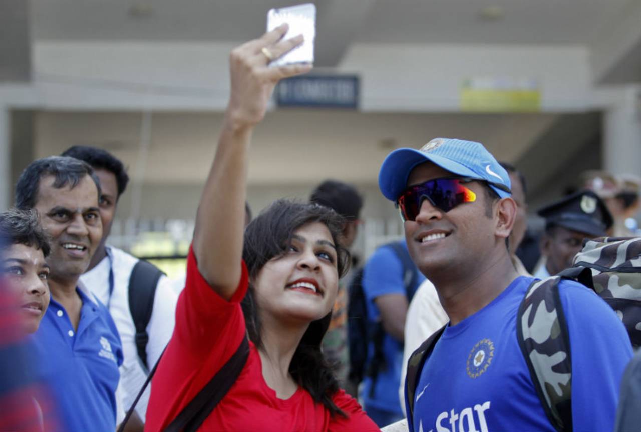 A fan clicks a selfie with MS Dhoni, Chennai, October 21, 2015